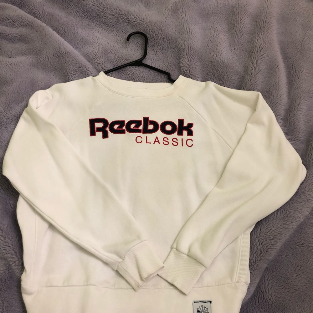 White Reebok crewneck.